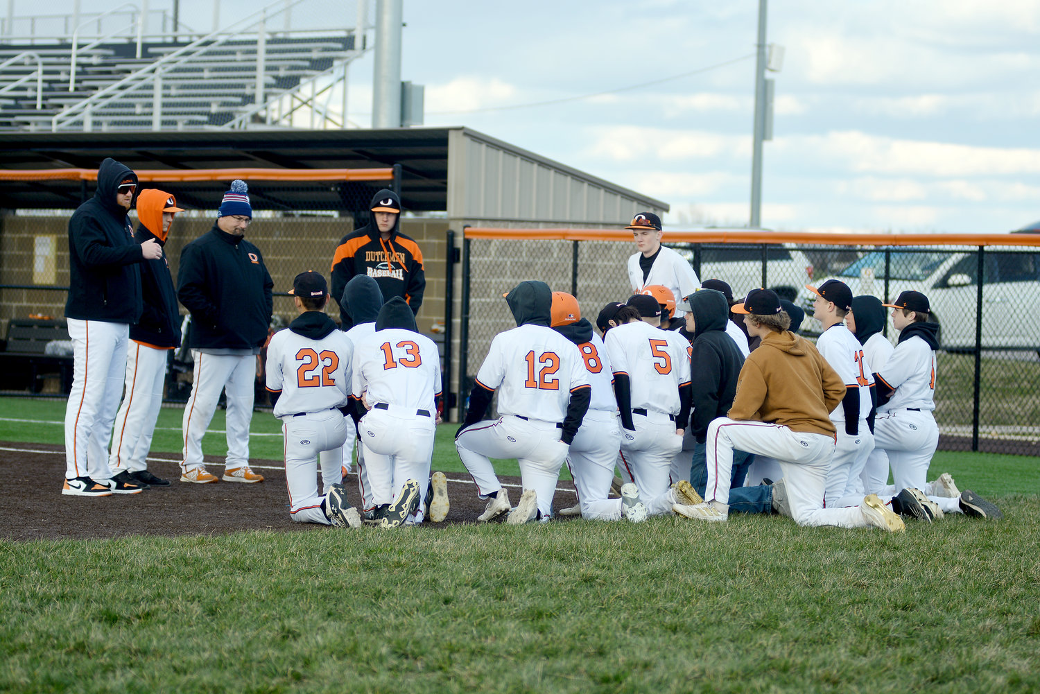 Steven Kemp (far left) addresses his Owensville Dutchmen baseball team following a 14-4 loss Friday afternoon to St. Clair’s Bulldogs at OHS Field during the opening round of the Four Rivers Conference (FRC) Preseason Baseball Tournament. Able to bounce back Monday night in the consolation semifinals against New Haven, Kemp picked up his first win as Dutchmen head baseball coach with a 12-0 victory in five innings over the visiting Shamrocks.